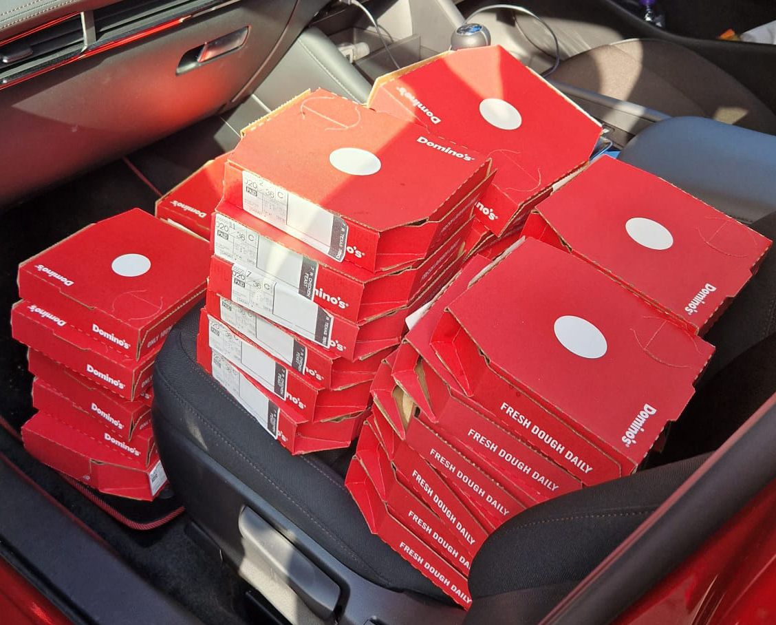Car full of small pizzas!